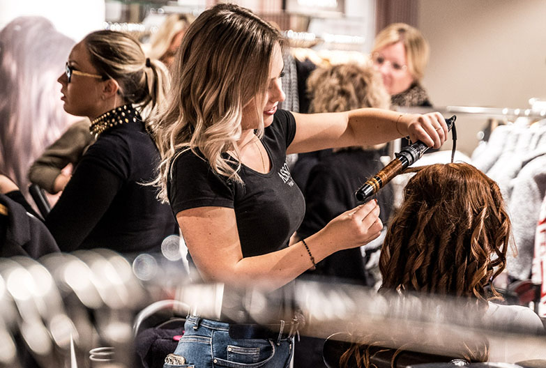 Woman cutting hair at a salon