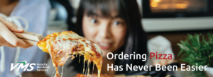 Woman excitedly looking at pizza.